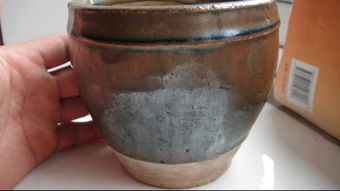 这个陶罐是古董吗,年代有多久啊,谢谢专家 