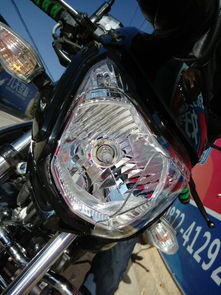 我摩托车的大灯灯罩撞碎了,修的说要整灯换 是吗 还说200多 需要吗 