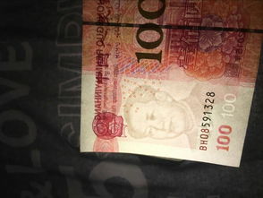我有一张新百元钞票左边毛爷爷的痣不怎么明显是为什么 有一张毛爷爷的痣差不多都没了. 