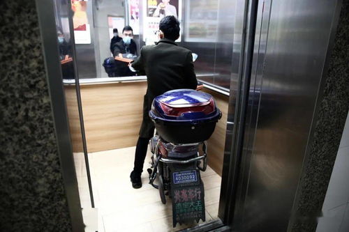 今年黄浦将有450台 智慧 电梯可以 拒载 电瓶车