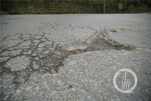 刚修好的路面又坑坑洼洼 南岸这条路为何屡修屡损